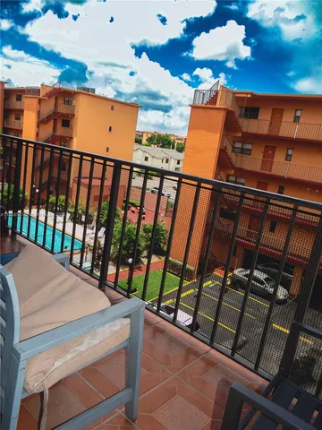 a view of a balcony with wooden floor
