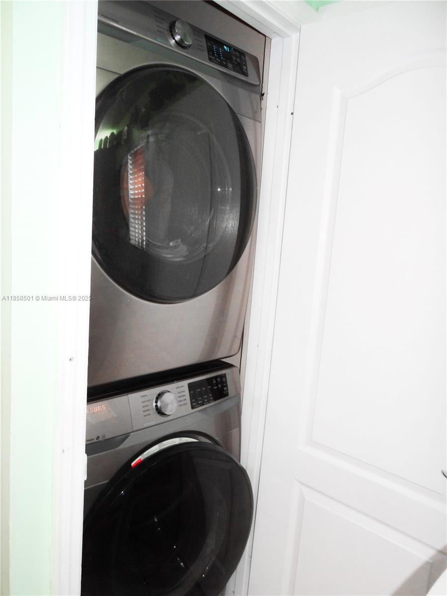 1800 West 54th Street, Unit 309 Hialeah, FL 33012 - Photo 9 of 19 a close up view of a washer and dryer