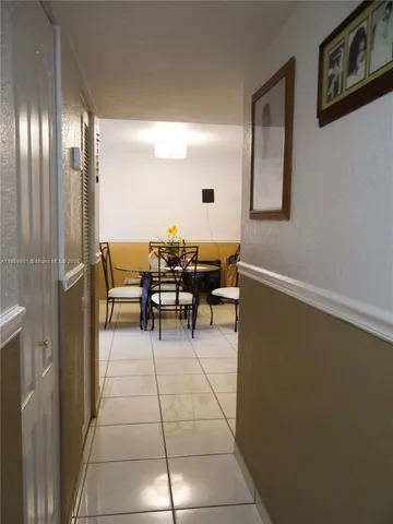a view of a livingroom with furniture and staircase