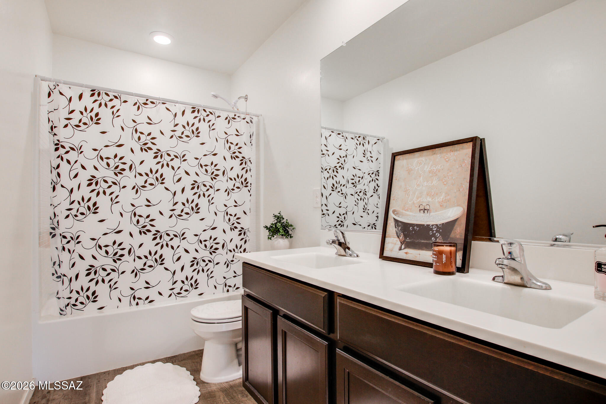 5987 South Antrim Loop Tucson, AZ 85706 - Photo 28 of 34 a bathroom with a sink toilet and mirror