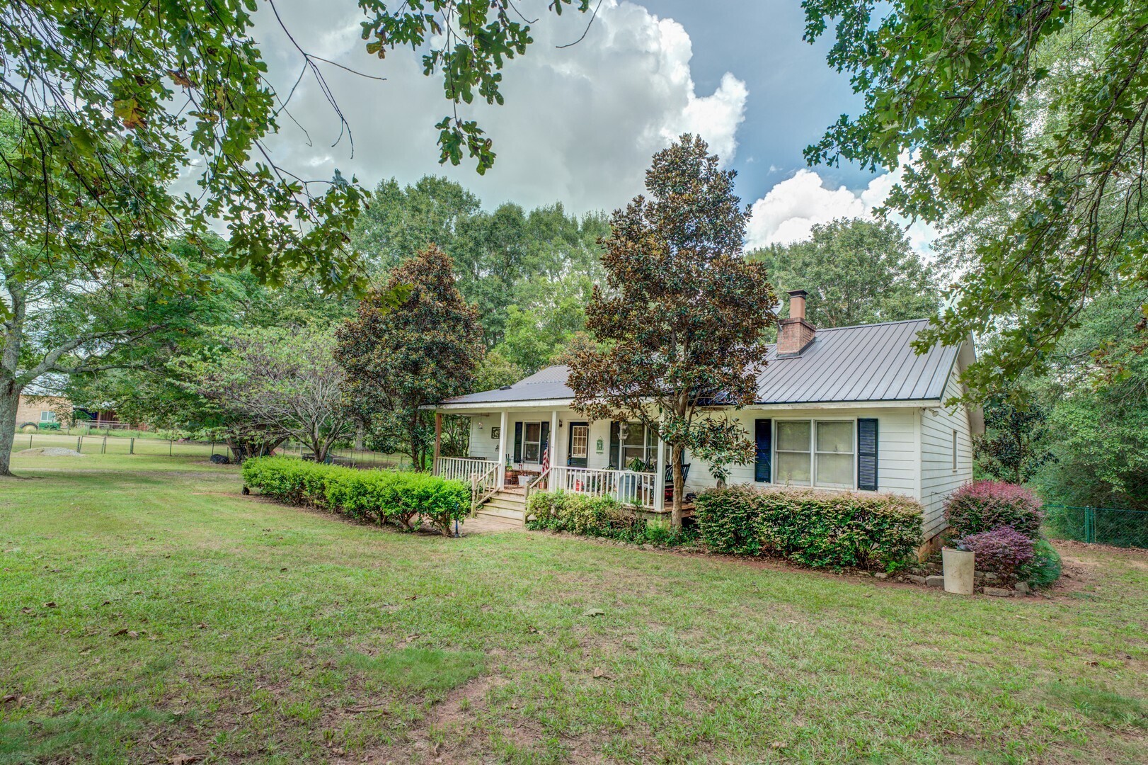 1121 Prospect Road Madison, GA 30650 - Photo 1 of 1 a house view with a garden space