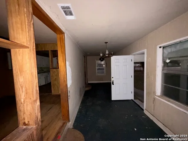 a bathroom with a glass door shower