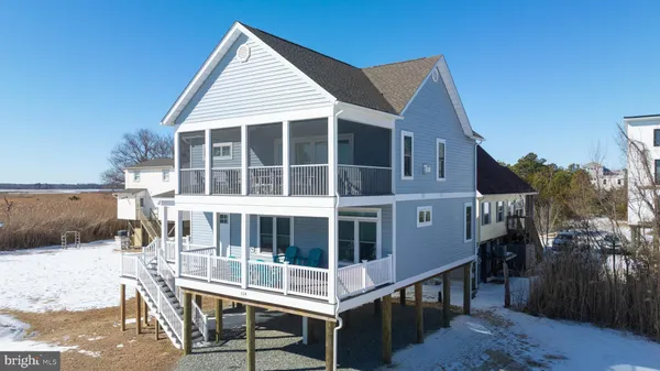 an aerial view of a house with a yard basket ball court and outdoor seating