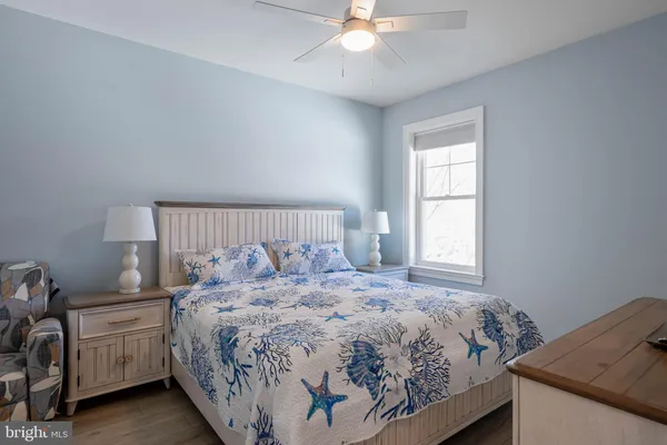 a bedroom with a bed and a dresser