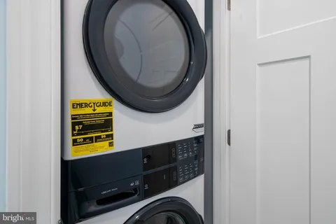 a view of a house with yard and sitting area