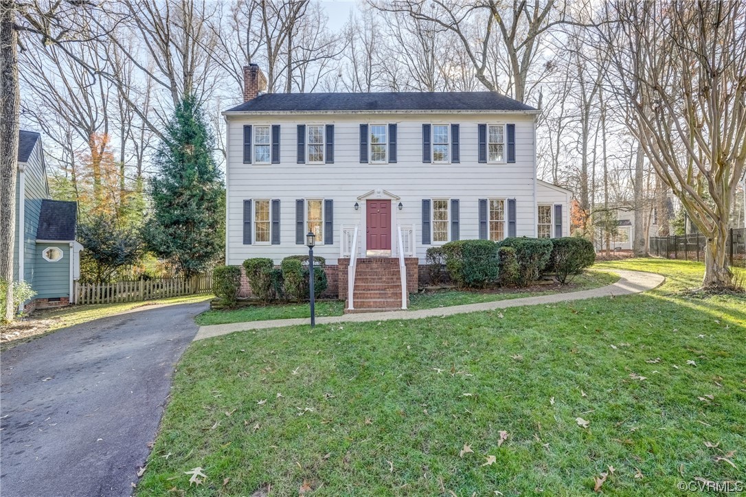 14703 Acorn Ridge Place Midlothian, VA 23112 - Photo 1 of 24 a front view of a house with a yard and trees