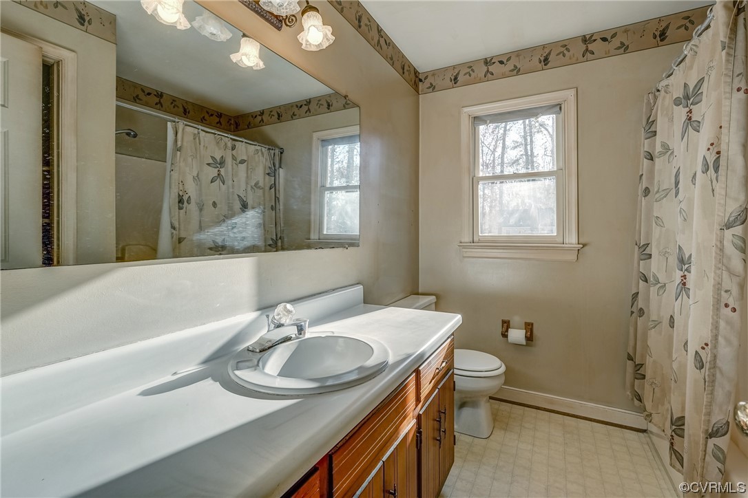 14703 Acorn Ridge Place Midlothian, VA 23112 - Photo 16 of 24 a bathroom with a sink a toilet and shower