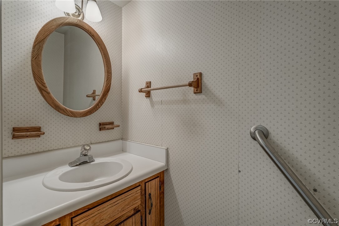 14703 Acorn Ridge Place Midlothian, VA 23112 - Photo 6 of 24 a bathroom with a sink and a mirror