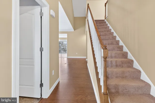 a view of a hallway with staircase