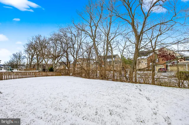 a view of a house with a snow in the yard