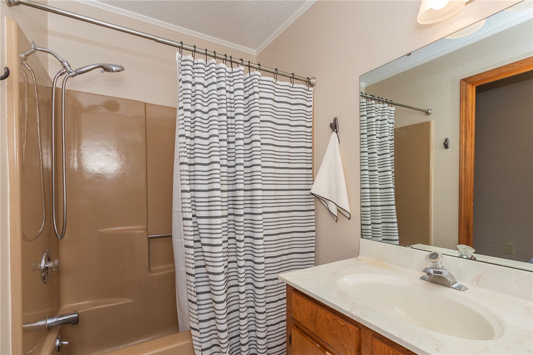 207 Laurel Ridge Road Anderson, SC 29621 - Photo 31 of 50 A well-lit bathroom features a functional vanity and a combined shower-tub unit.