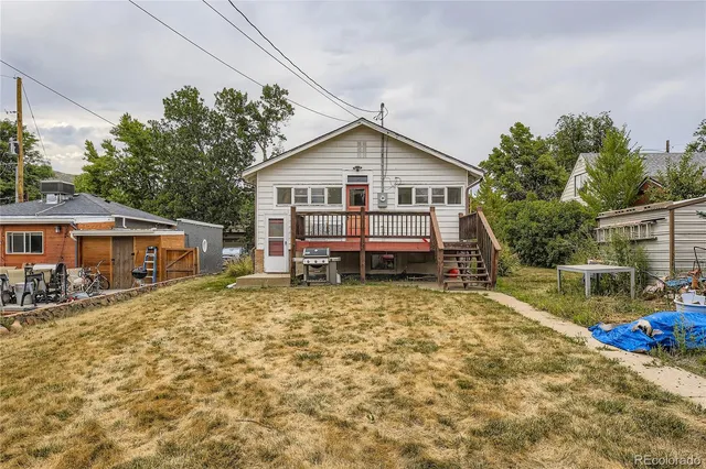 a house with trees in the background