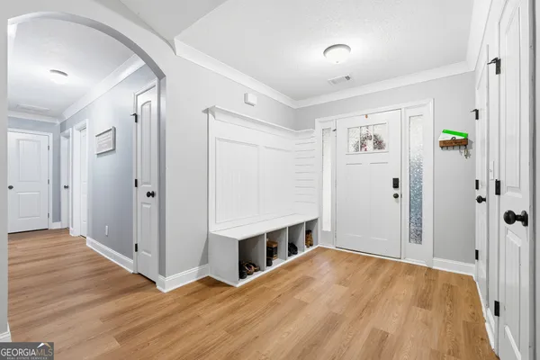 a view of a room with wooden floor and window