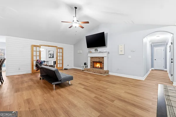 a living room with furniture and a flat screen tv