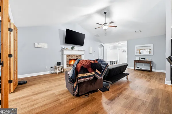 a living room with furniture and a flat screen tv