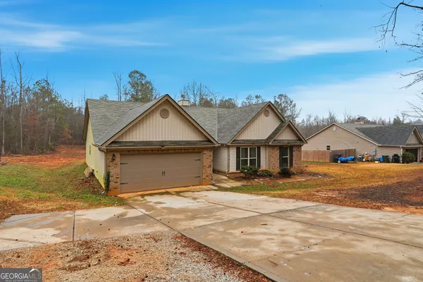 a view of outdoor space and front view of a house
