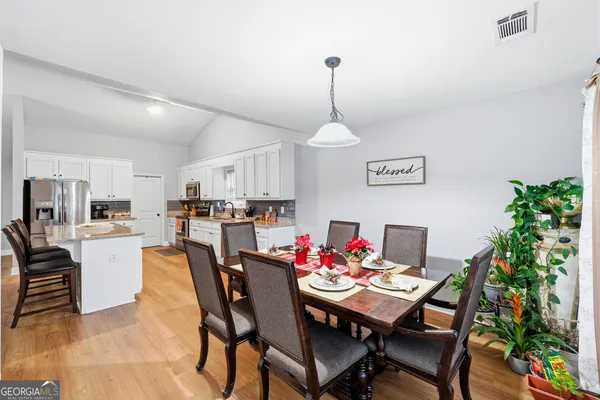 a view of a dining room with furniture