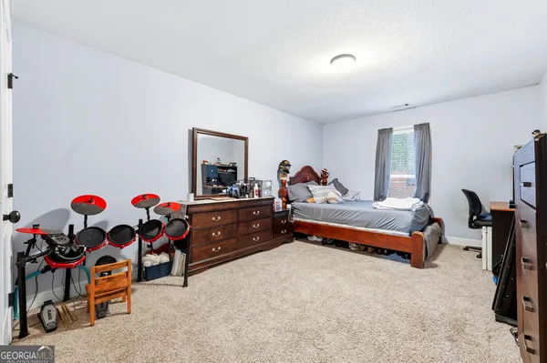a bed room with furniture and toys
