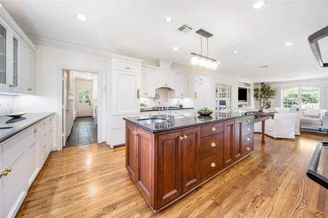 a kitchen with a sink and cabinets