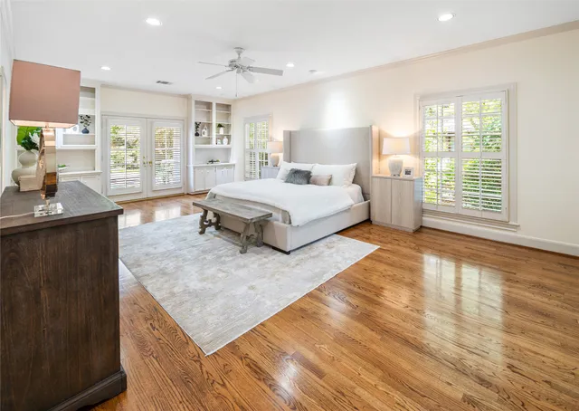 a large room with a bed and a view of kitchen