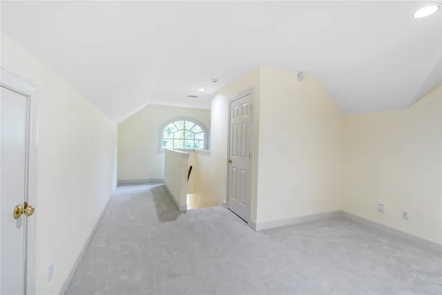 a room with a dresser and a window