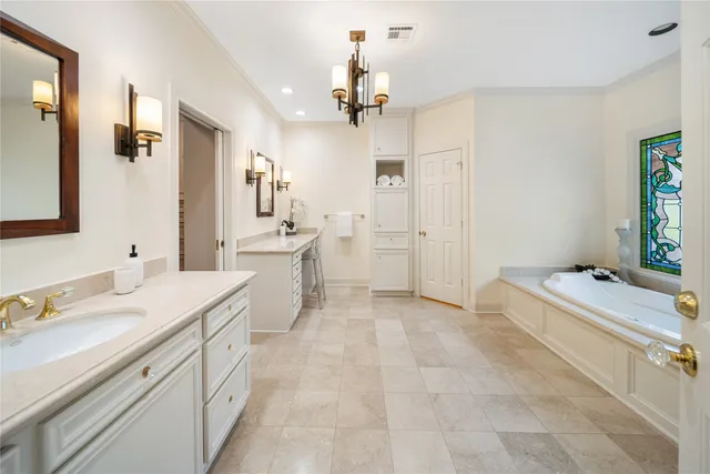 a bathroom with a sink and a window