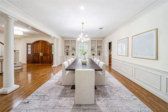 a large living room with a chandelier