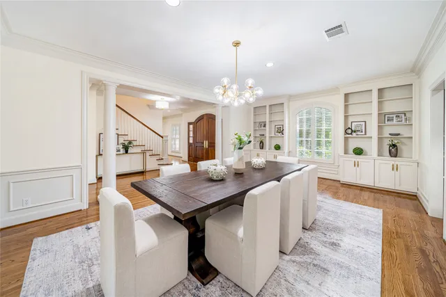 a very nice looking dining room with a table and chairs