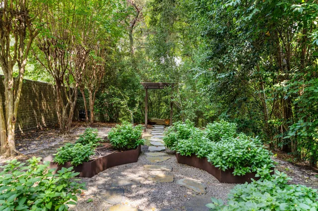 a front view of a house with a yard table and chairs