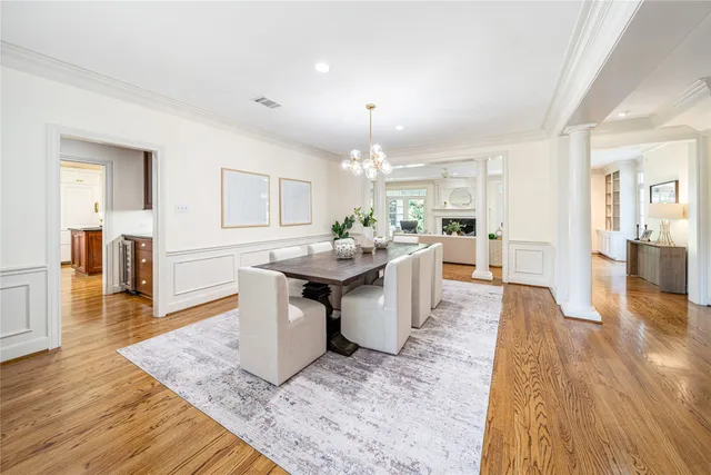 a living room with fireplace furniture and a wooden floor