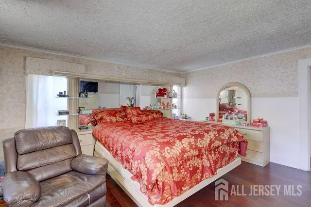 a bedroom with bed and window