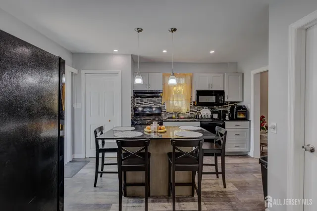 a kitchen with a table and chairs in it