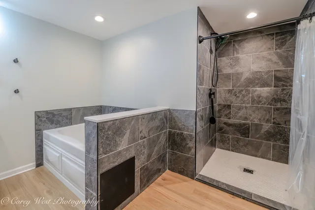 a bathroom with a shower and toilet