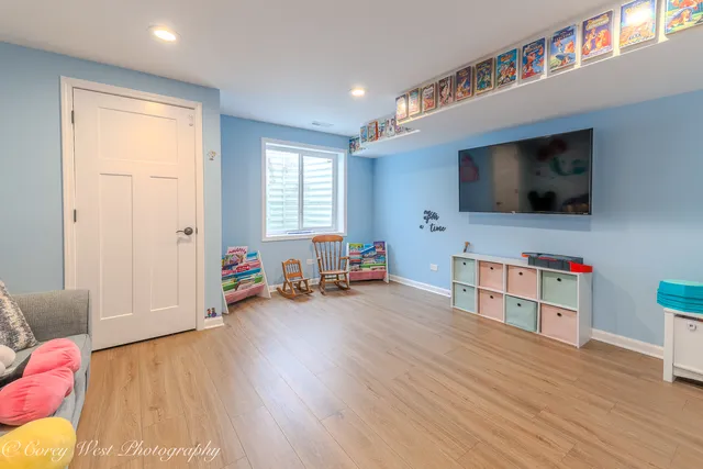 a view of a livingroom with furniture and a flat screen tv