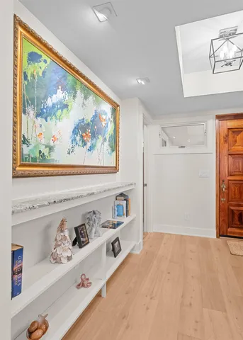 a view of a bedroom with baby bed and closet