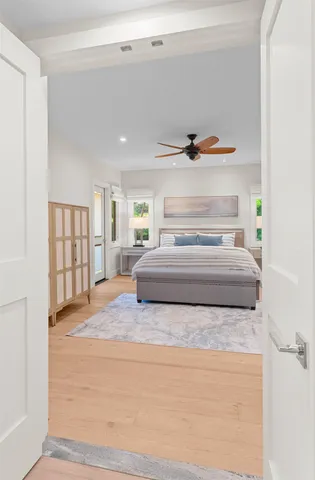 a spacious bedroom with a bed and window