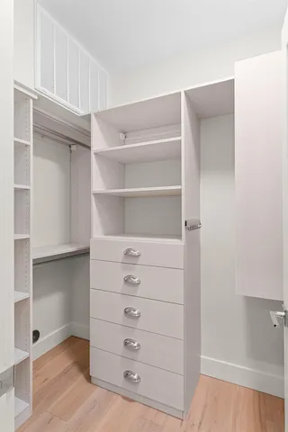 a view of a patio with couches potted plants and a big yard