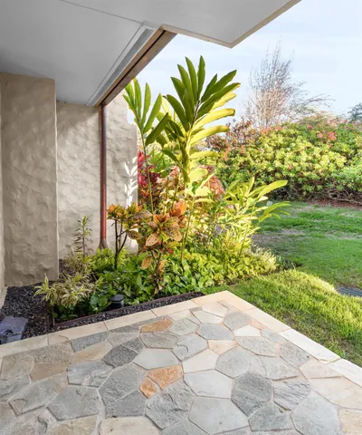 a view of a pathway both side of house