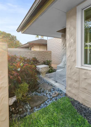 a view of a house with a yard and a garden