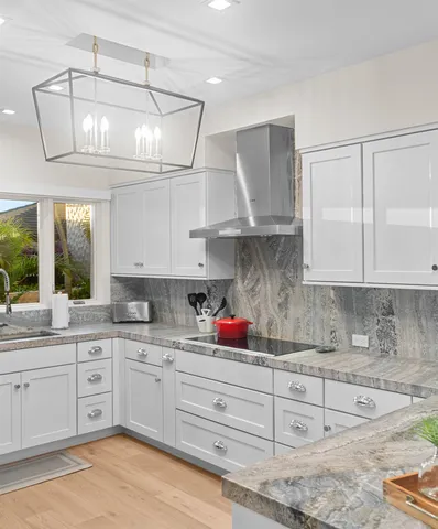 a kitchen with cabinets a sink and appliances