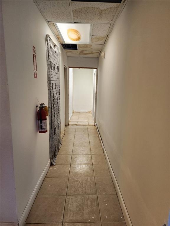 6958 Main Street Lithonia, GA 30058 - Photo 15 of 55 a hallway with white walls and window