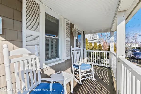 a view of a balcony with furniture