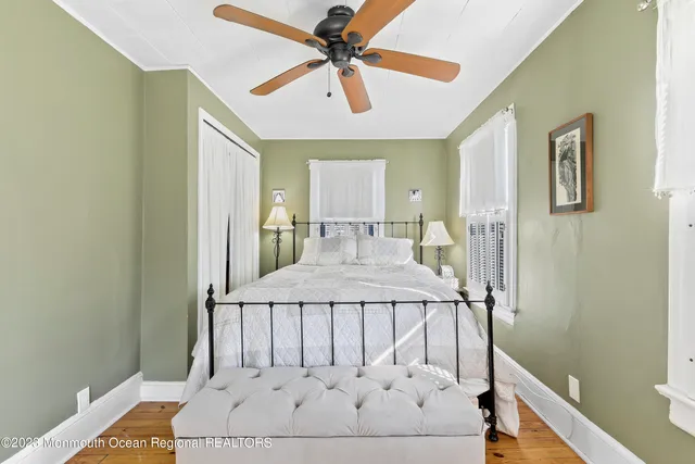 a spacious bedroom with a bed and a table