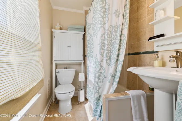 a bathroom with a toilet and a sink
