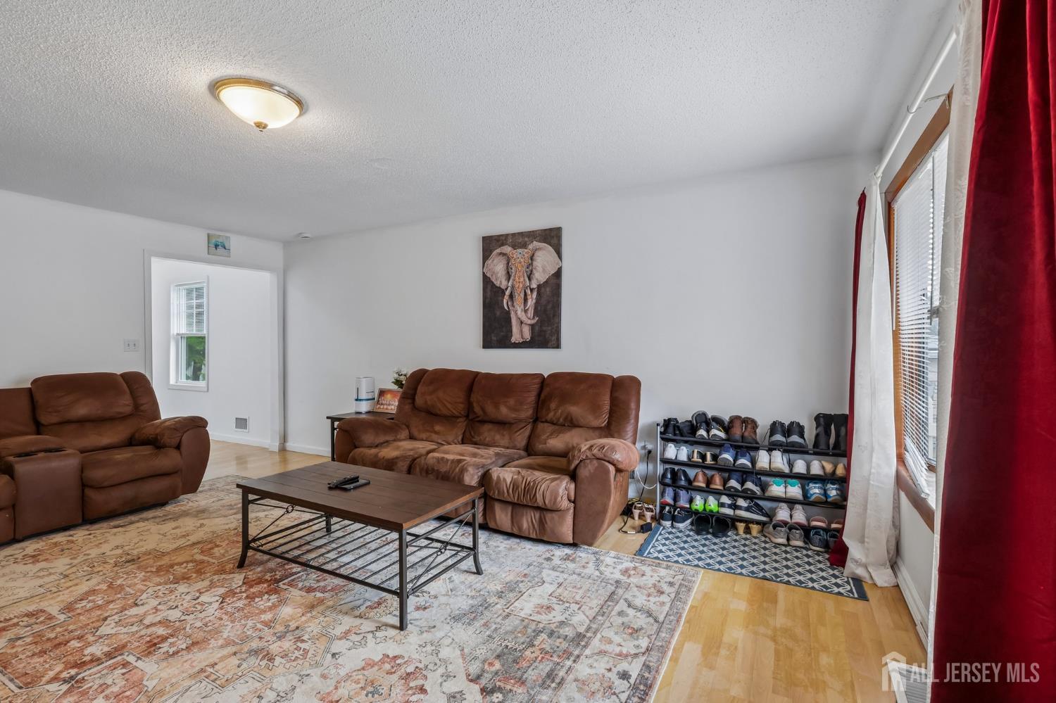 36 Henry Street Edison, NJ 08820 - Photo 5 of 42 a living room with furniture and a window