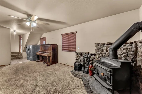 a bedroom with furniture and a chandelier