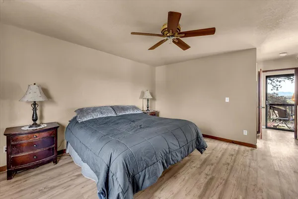 a bathroom with a granite countertop sink mirror vanity and toilet