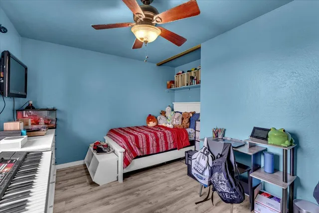 a bedroom with a workspace