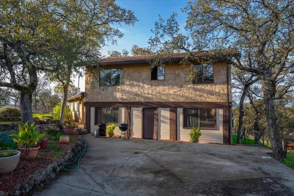 a backyard of a house with lots of green space