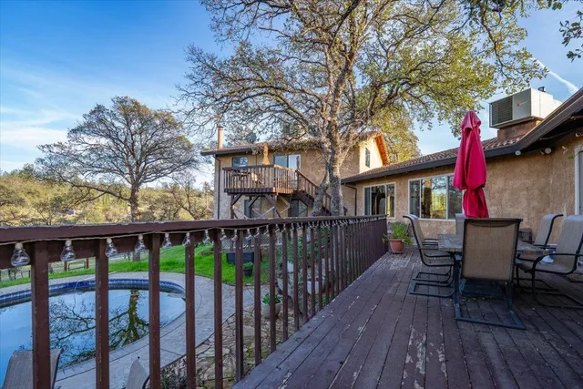 a view of a yard with large trees